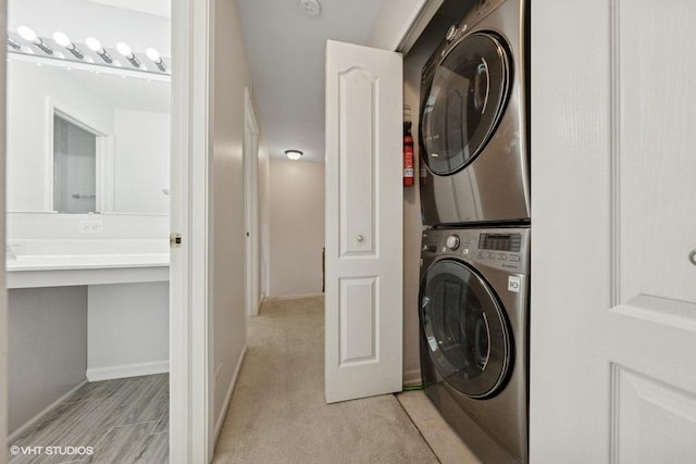 2746 Middleton Ct, Aurora, IL 60503 - laundry room with stacked washer / dryer and baseboards