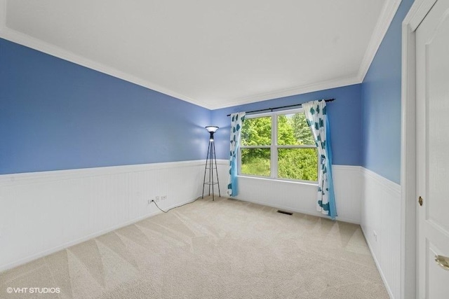 2746 Middleton Ct, Aurora, IL 60503 - carpeted empty room featuring wainscoting and ornamental molding