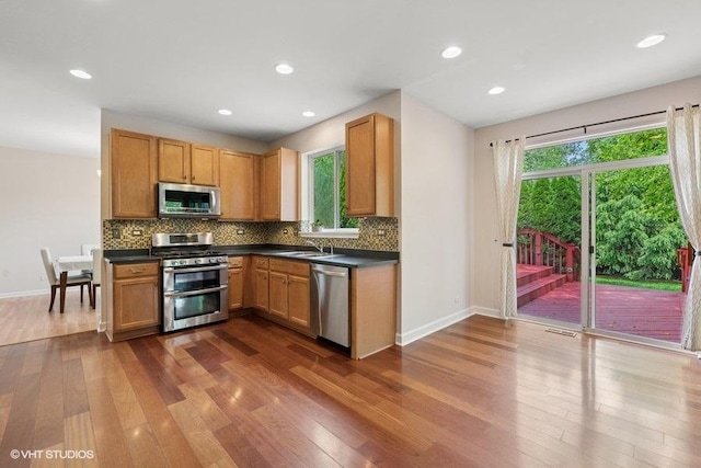 2746 Middleton Ct, Aurora, IL 60503 - kitchen featuring stainless steel appliances, dark wood-type flooring, healthy amount of natural light, baseboards, and recessed lighting
