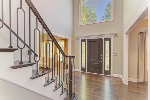 6205 Brookridge Dr, Plainfield, IL 60586 - entryway with a towering ceiling, wood finished floors, stairway, and baseboards