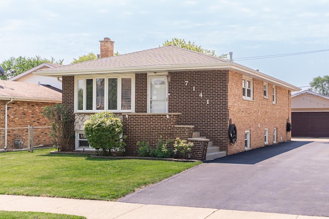 7141 W 72nd St, Chicago, IL 60638 - view of front of property featuring a chimney, a front lawn, brick siding, an outbuilding, and a garage