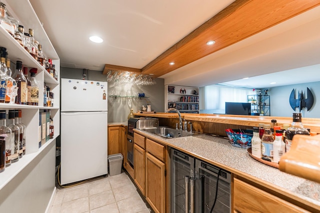 7141 W 72nd St, Chicago, IL 60638 - kitchen featuring freestanding refrigerator, light tile patterned floors, brown cabinets, recessed lighting, and beverage cooler