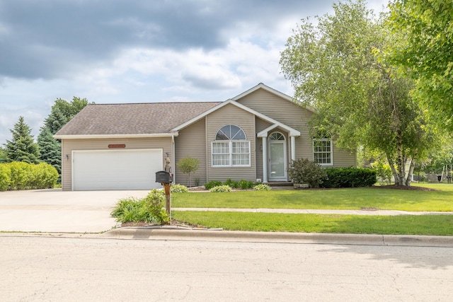 608 Cherry Tree Ln, Genoa, IL 60135 - view of front of home with a garage, a front yard, and driveway