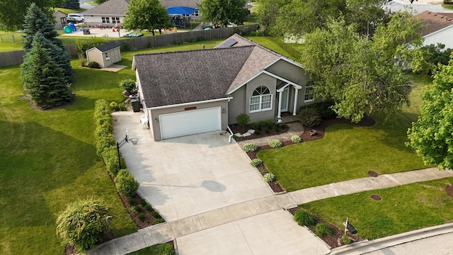 608 Cherry Tree Ln, Genoa, IL 60135 - view of front facade with concrete driveway, a garage, and a shingled roof