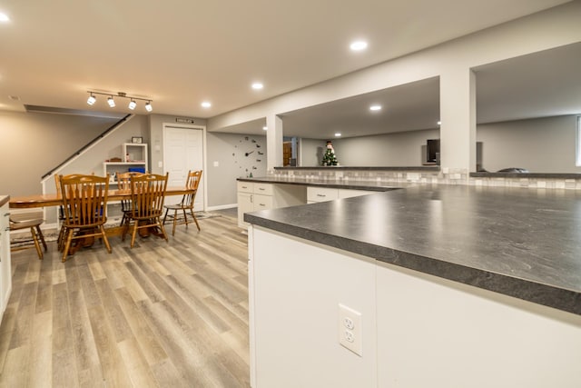 608 Cherry Tree Ln, Genoa, IL 60135 - kitchen with dark countertops, white cabinets, light wood-type flooring, recessed lighting, and a peninsula
