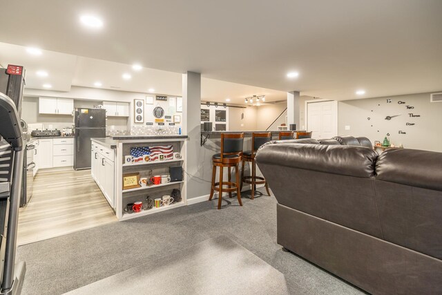 608 Cherry Tree Ln, Genoa, IL 60135 - living room with recessed lighting and bar