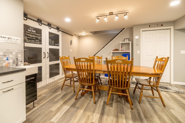 608 Cherry Tree Ln, Genoa, IL 60135 - dining space with light wood-style flooring and baseboards