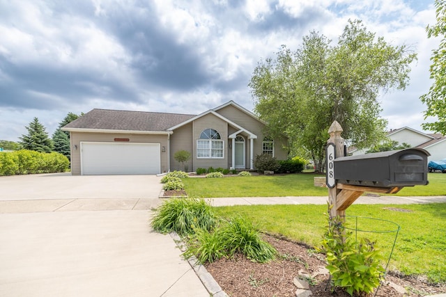 608 Cherry Tree Ln, Genoa, IL 60135 - view of front facade featuring a garage, driveway, and a front lawn