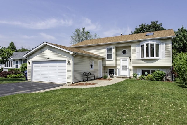 33061 N Rolling Hills Rd, Grayslake, IL 60030 - raised ranch featuring asphalt driveway, an attached garage, and a front yard