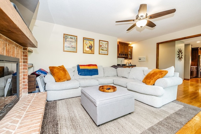 181 N Meadowlark Dr, Hawthorn Woods, IL 60047 - living room with a ceiling fan, wood finished floors, and a brick fireplace