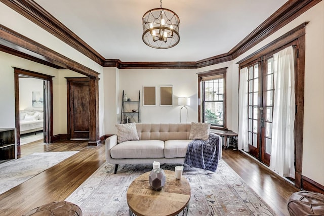 5520 S Cornell Ave Unit 1S, Chicago, IL 60637 - living room featuring a chandelier, wood-type flooring, french doors, and ornamental molding