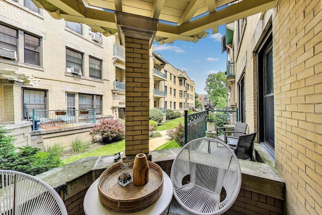 5520 S Cornell Ave Unit 1S, Chicago, IL 60637 - balcony with cooling unit and outdoor dining space