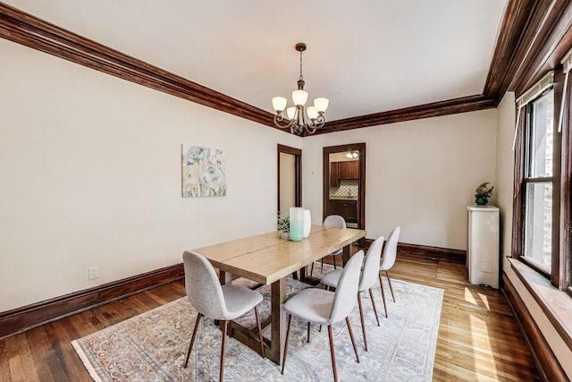 5520 S Cornell Ave Unit 1S, Chicago, IL 60637 - dining room featuring crown molding, a chandelier, and wood-type flooring