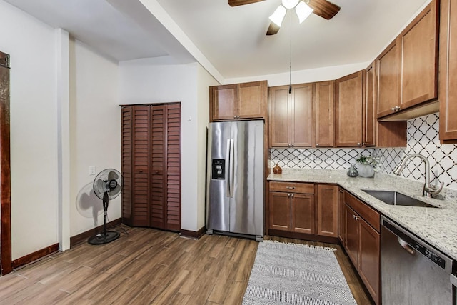 5520 S Cornell Ave Unit 1S, Chicago, IL 60637 - kitchen with stainless steel appliances, backsplash, wood finished floors, and light stone counters