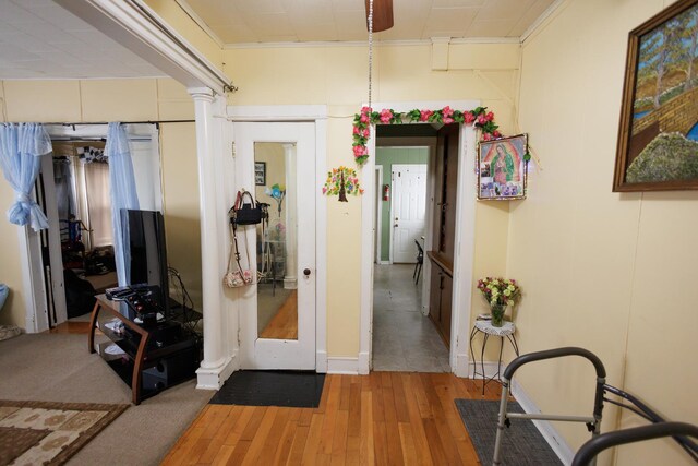341 S 5th Ave, Kankakee, IL 60901 - corridor with wood-type flooring, decorative columns, and baseboards