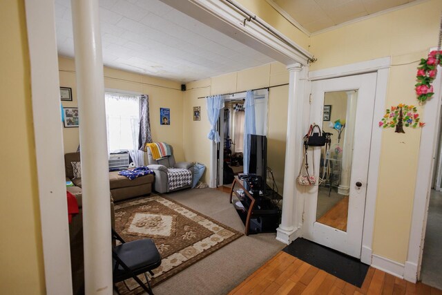 341 S 5th Ave, Kankakee, IL 60901 - corridor with ornate columns and hardwood / wood-style flooring