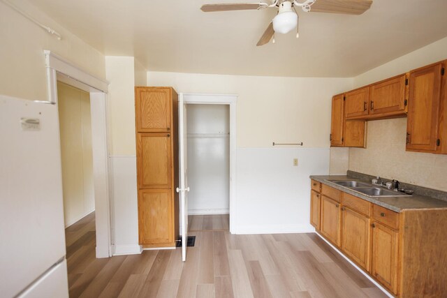 341 S 5th Ave, Kankakee, IL 60901 - kitchen with a sink, freestanding refrigerator, ceiling fan, tasteful backsplash, and light wood-style floors
