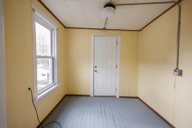 341 S 5th Ave, Kankakee, IL 60901 - unfurnished room with healthy amount of natural light, light wood-style floors, ornamental molding, and baseboards