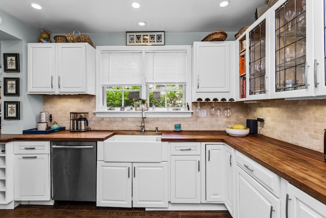 1414 Lincoln St, Evanston, IL 60201 - kitchen with butcher block counters, dishwasher, glass insert cabinets, white cabinetry, and recessed lighting