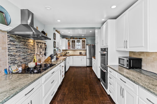 1414 Lincoln St, Evanston, IL 60201 - kitchen with island exhaust hood, stainless steel appliances, backsplash, light stone counters, and recessed lighting
