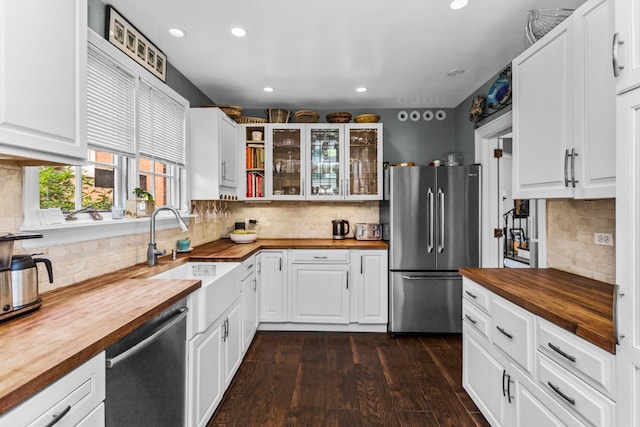 1414 Lincoln St, Evanston, IL 60201 - kitchen with wood counters, freestanding refrigerator, dishwasher, tasteful backsplash, and recessed lighting