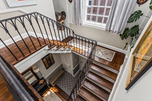 1414 Lincoln St, Evanston, IL 60201 - stairs featuring baseboards and wood finished floors