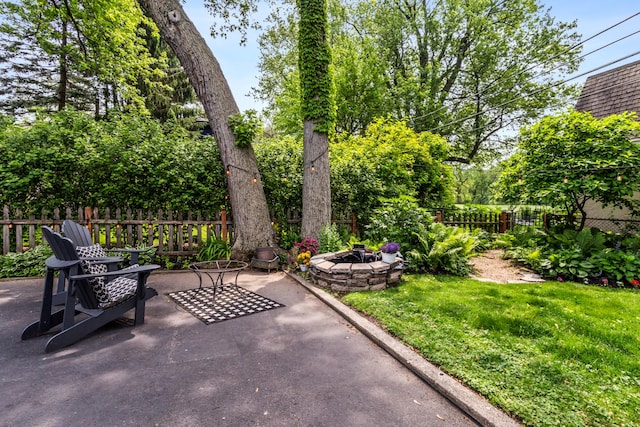 1414 Lincoln St, Evanston, IL 60201 - fenced backyard with an outdoor fire pit and a patio area