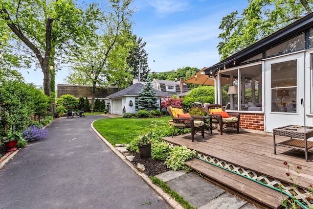 1414 Lincoln St, Evanston, IL 60201 - view of yard with a deck, an outdoor structure, and a garage