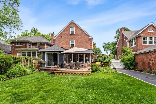 1414 Lincoln St, Evanston, IL 60201 - back of house featuring a deck, a gate, and brick siding