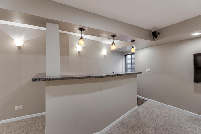 1 W Pheasant Trl, Lake In The Hills, IL 60156 - indoor wet bar featuring dark colored carpet, baseboards, and hanging light fixtures