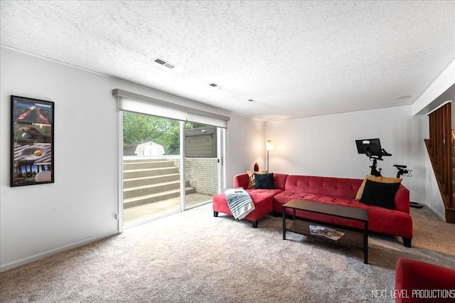 636 Cambridge Dr, Schaumburg, IL 60193 - carpeted living room featuring a textured ceiling and baseboards