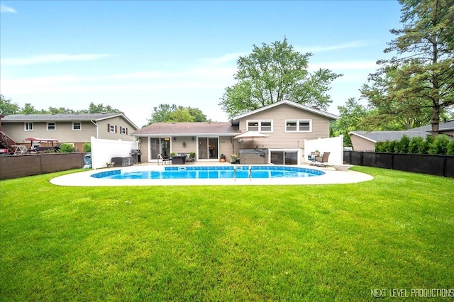 636 Cambridge Dr, Schaumburg, IL 60193 - rear view of house with a fenced backyard, a patio, and a jacuzzi