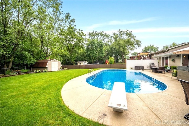 636 Cambridge Dr, Schaumburg, IL 60193 - view of swimming pool featuring a shed, a diving board, a fenced backyard, a patio area, and view of wooded area