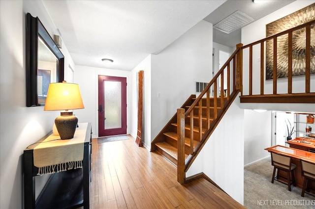 636 Cambridge Dr, Schaumburg, IL 60193 - foyer entrance featuring stairway and wood finished floors
