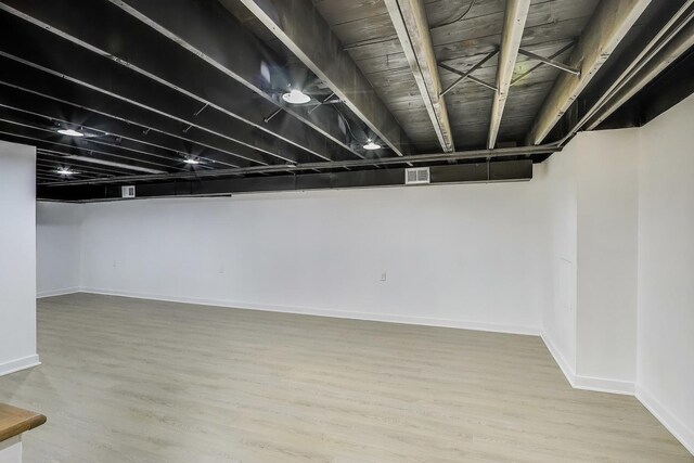 839 N Kildare Ave, Chicago, IL 60651 - finished below grade area featuring baseboards and wood finished floors