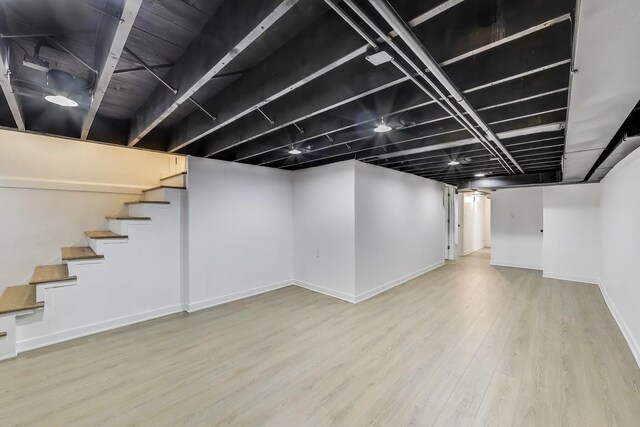 839 N Kildare Ave, Chicago, IL 60651 - finished below grade area with wood finished floors, baseboards, and stairs