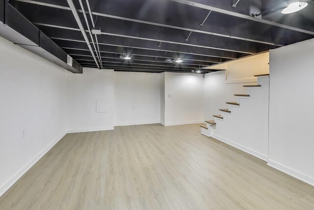 839 N Kildare Ave, Chicago, IL 60651 - finished below grade area featuring wood finished floors, stairway, and baseboards