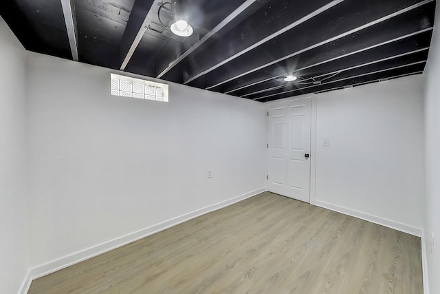 839 N Kildare Ave, Chicago, IL 60651 - below grade area featuring wood finished floors and baseboards