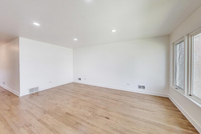 839 N Kildare Ave, Chicago, IL 60651 - empty room with light wood finished floors, healthy amount of natural light, recessed lighting, and baseboards