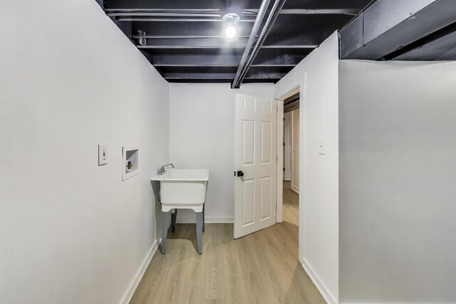 839 N Kildare Ave, Chicago, IL 60651 - laundry area featuring wood finished floors, washer hookup, and baseboards