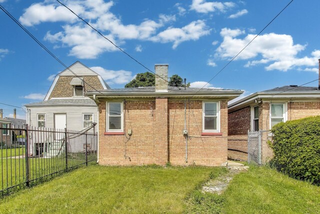 839 N Kildare Ave, Chicago, IL 60651 - back of property featuring a chimney and brick siding