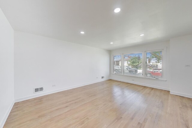 839 N Kildare Ave, Chicago, IL 60651 - spare room featuring light wood-style floors, recessed lighting, and baseboards