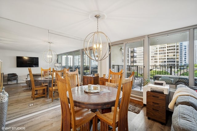 400 E Randolph St Unit 826, Chicago, IL 60601 - dining area featuring a chandelier and wood finished floors