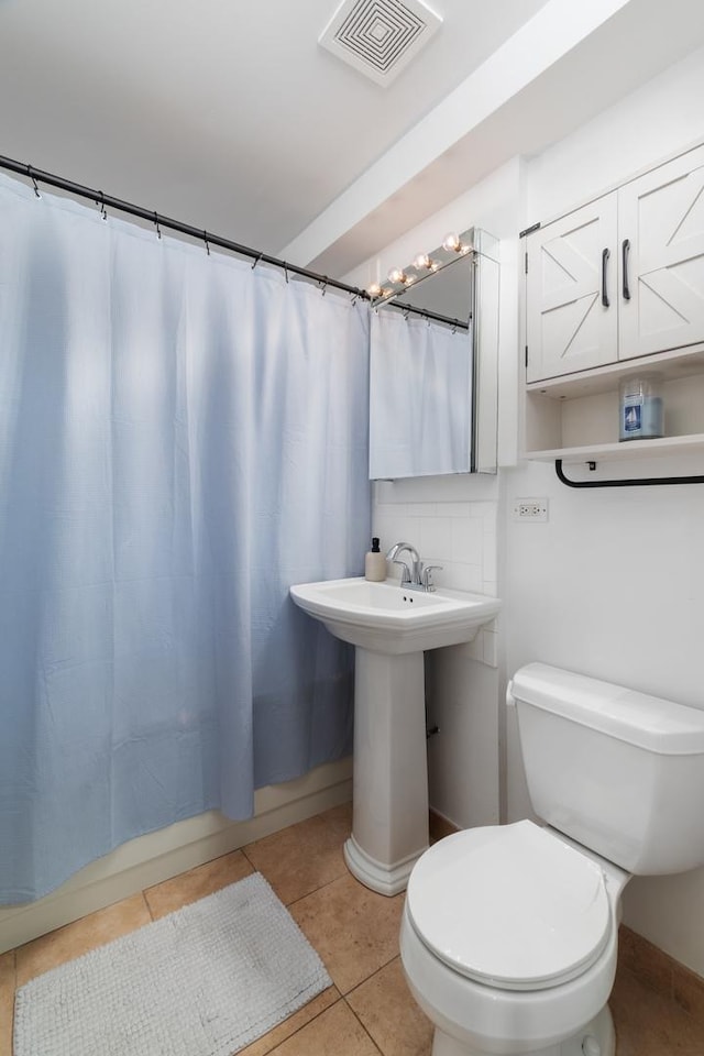 2546 W George St Unit G, Chicago, IL 60618 - bathroom with toilet, tile patterned flooring, and a shower with shower curtain