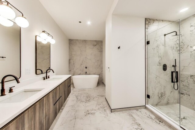613 N Ogden Ave Unit 2E, Chicago, IL 60642 - full bathroom with marble tiled floors, a marble finish shower, double vanity, a freestanding tub, and recessed lighting