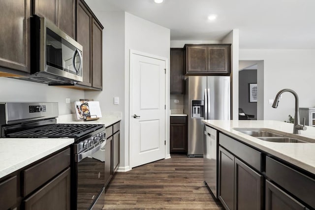 14712 S Azalia Cir, Plainfield, IL 60544 - kitchen featuring appliances with stainless steel finishes, a sink, dark brown cabinetry, dark wood finished floors, and recessed lighting