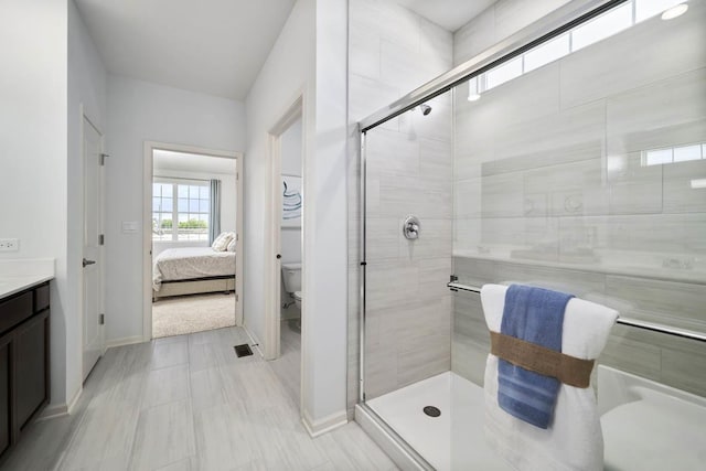 14712 S Azalia Cir, Plainfield, IL 60544 - bathroom with a shower stall, connected bathroom, toilet, and vanity
