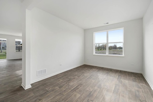14712 S Azalia Cir, Plainfield, IL 60544 - spare room featuring dark wood-type flooring and baseboards