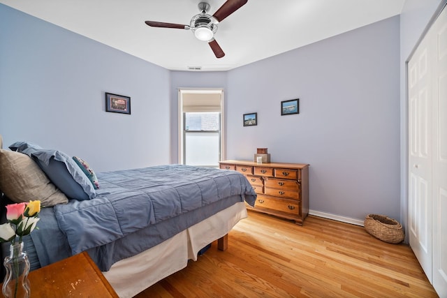 4705 N Campbell Ave Unit 3, Chicago, IL 60625 - bedroom featuring light wood-style flooring, a closet, baseboards, and a ceiling fan