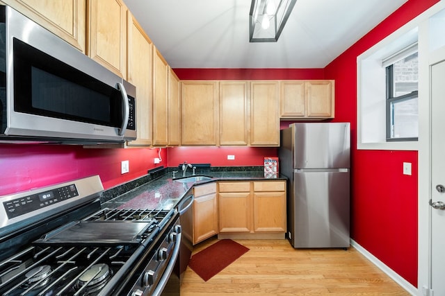 4705 N Campbell Ave Unit 3, Chicago, IL 60625 - kitchen with stainless steel appliances, a sink, light wood-style floors, and light brown cabinets